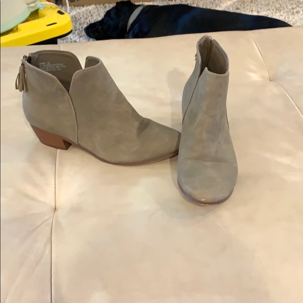 tan/grey booties with a tassel zipper on the back